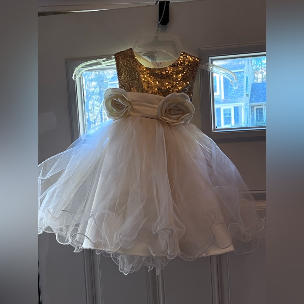 Girls size gold sequences/ivory dress, good condition.  Skirt has 4-layers